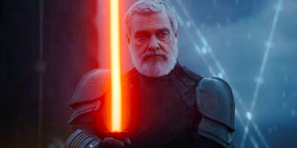 Ray Stevenson holding a lightsaber in Ahsoka.