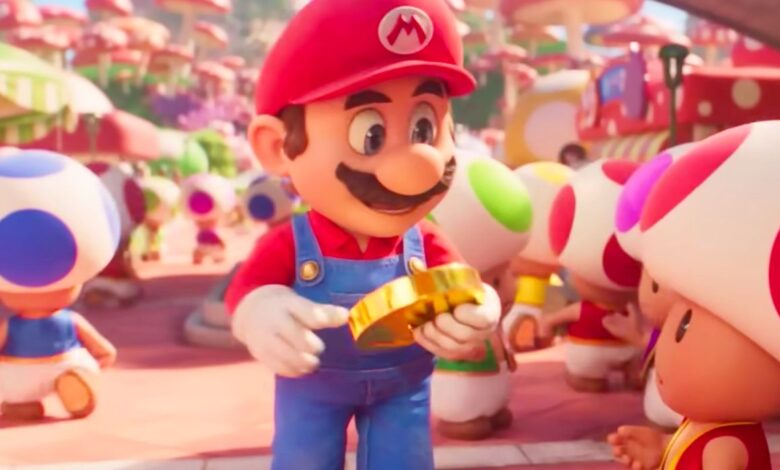 Mario holding a gold coin in The Super Mario Bros. Movie.