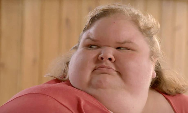 Tammy Slaton from 1000-Lb Sisters wearing orange shirt looking to the side