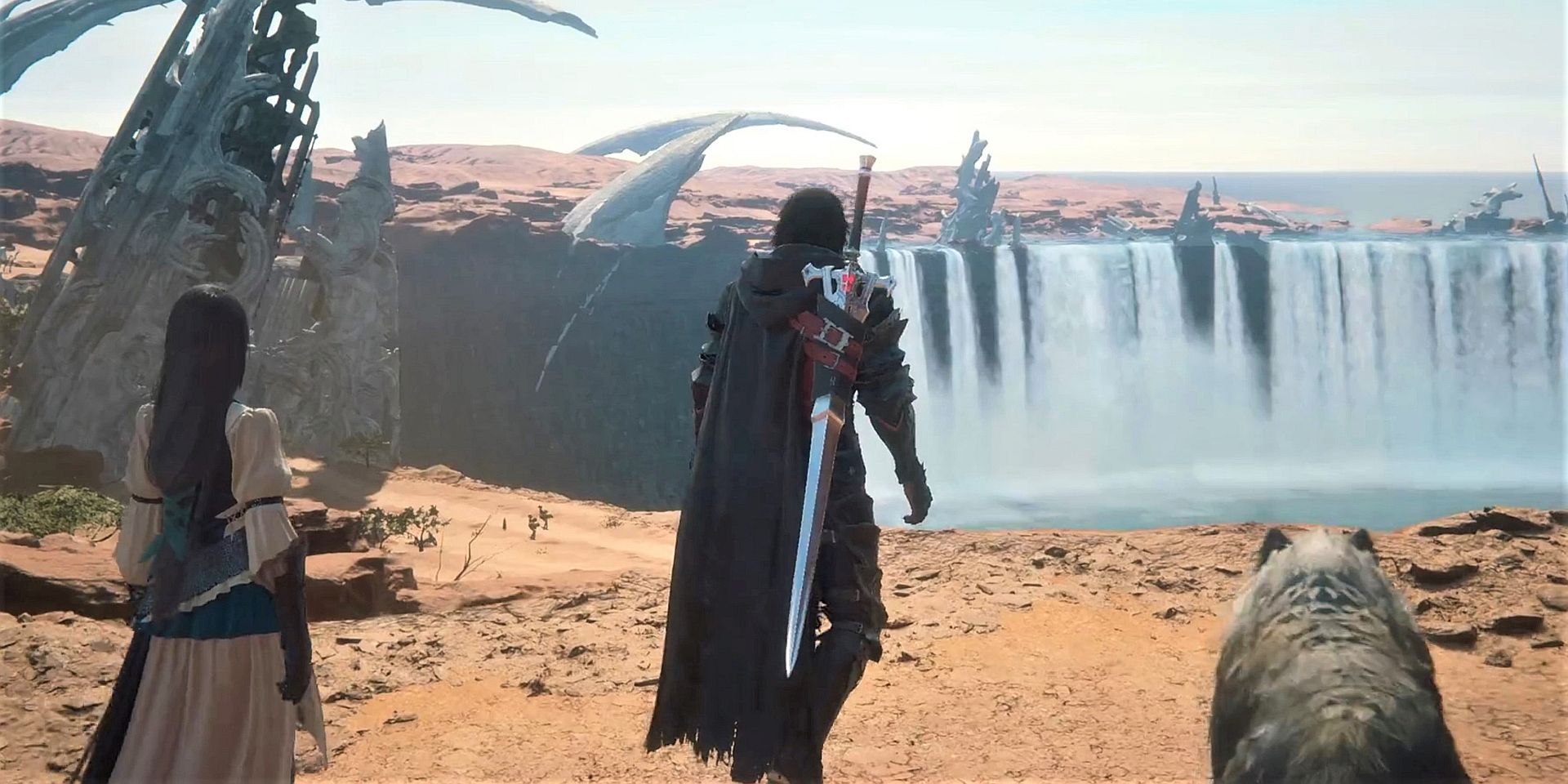Clive, Jill, and Torgal walk toward the sandy precipice of a cascading waterfall in Final Fantasy 16