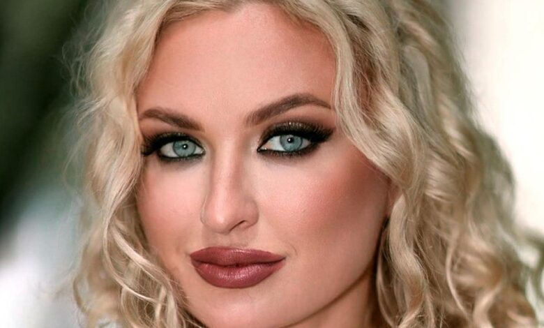 Natalie Mordovtseva from 90 Day Fiance wearing glam makeup smirking