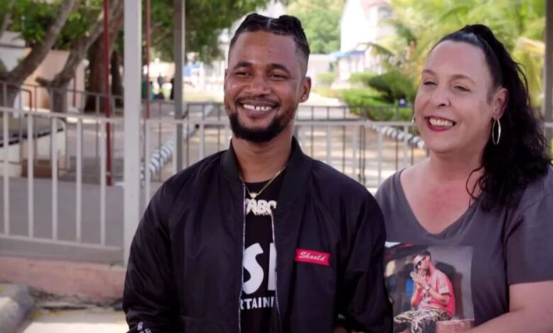 Usman Sojaboy Umar and Kim Menzies smiling on 90 Day Fiancé