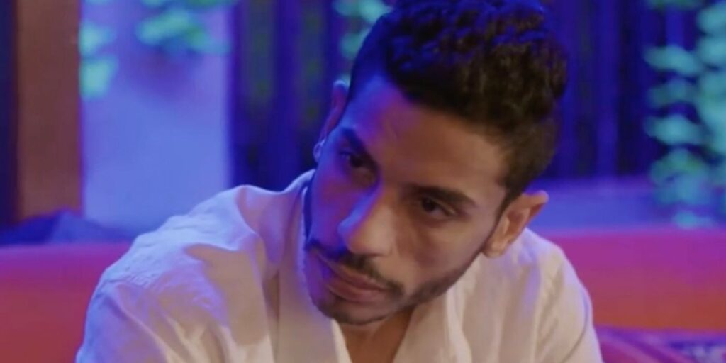 Mahmoud 90 Day Fiancé looking down with serious expression