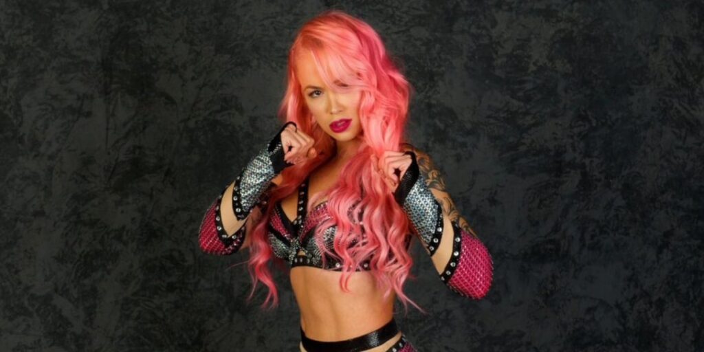 Paola Mayfield from 90 Day Fiance in a wrestling pose