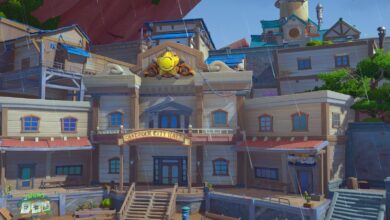 A screenshot of Sandrock City Hall during a light rain in the game My Time At Sandrock.