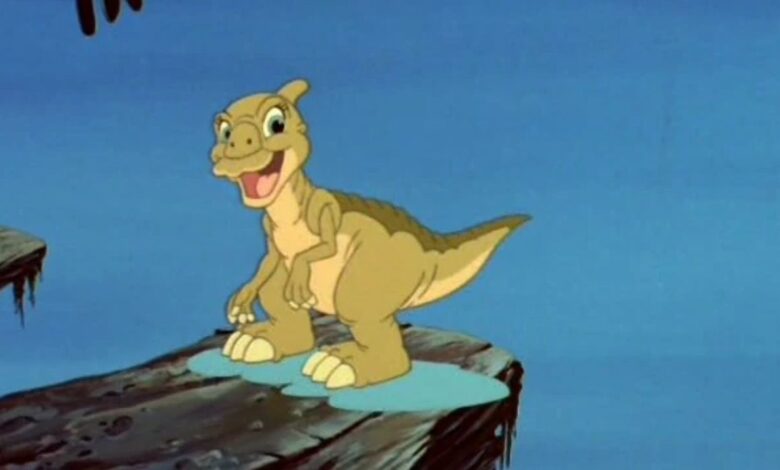 Ducky looks happy while standing on a rock in Land Before Time