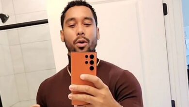 Pedro Jimeno from The Family Chantel holding phone wearing brown shirt