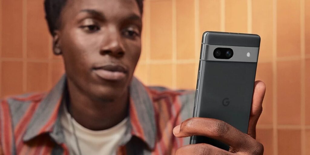 Person using face unlock with Pixel 7a