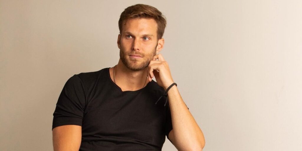 adan stott vanderpump rules black t shirt thoughtful pose Instagram