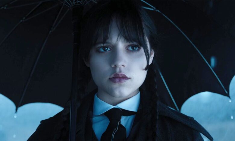 Jenna Ortega as Wednesday holding an umbrella in episode 7