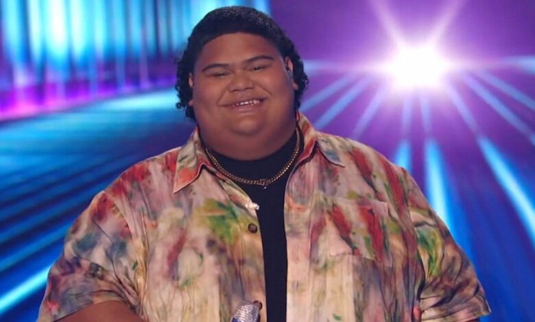 American Idol Iam Tongi Smiling in printed shirt smiling blue background
