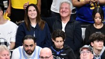 Dustin Hoffman and Lisa Hoffman attend a playoff basketball game.