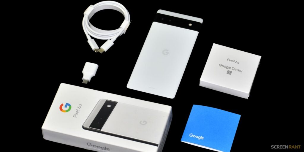 Pixel 6a's box contents on a table top setup