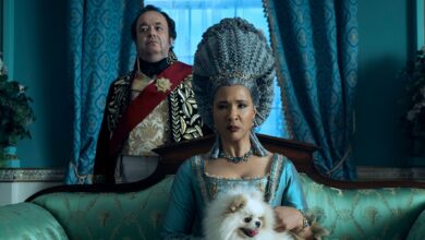 Queen Charlotte sits on a couch in Bridgerton