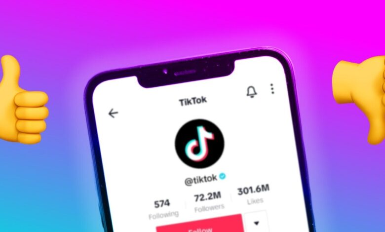TikTok's account shown on a phone alongside thumbs up and thumbs down emoji
