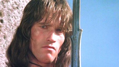 Arnold Schwarzenegger in Conan the Barbarian looking intense while holding a giant sword