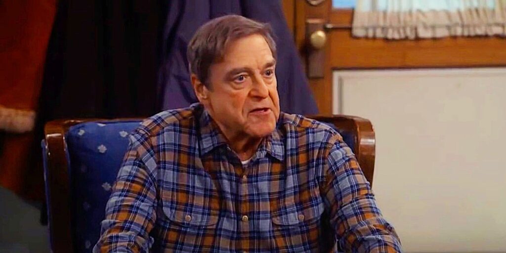 Dan (John Goodman) sitting down in The Conners season 5 episode 21