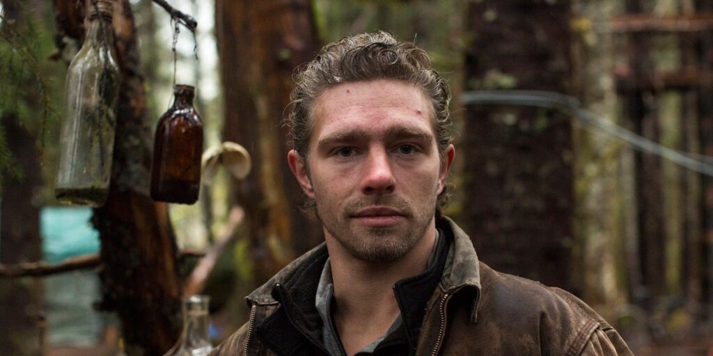 Matt Brown Alaskan Bush People posing in the woods brown jacket CROPPED