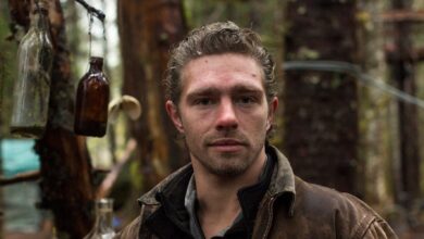 Matt Brown Alaskan Bush People posing in the woods brown jacket CROPPED