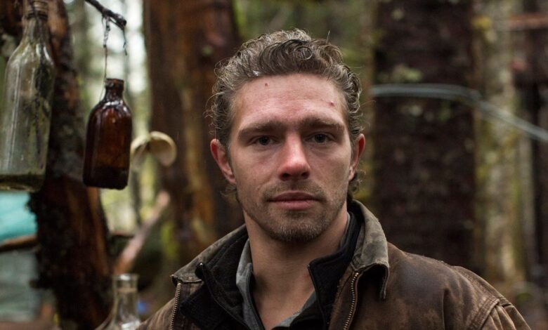 Matt Brown Alaskan Bush People posing in the woods brown jacket CROPPED
