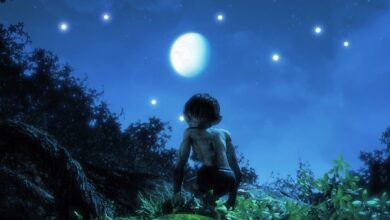 Golllum sitting on a hill at nighttime, while looking up a the full moon in a dark blue sky.