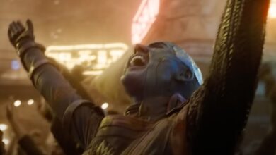 Nebula throwing her arms in the air in celebration during a scene from Guardians of the Galaxy Vol. 3.
