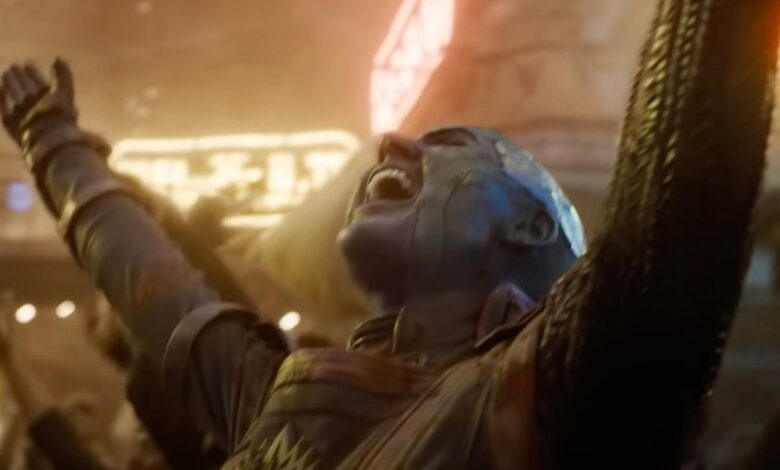 Nebula throwing her arms in the air in celebration during a scene from Guardians of the Galaxy Vol. 3.