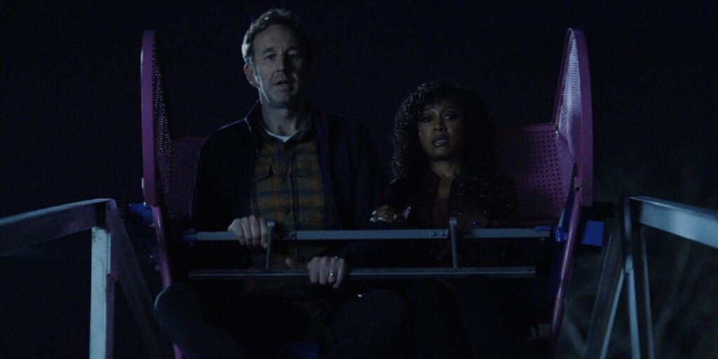 The Big Door Prize's Dusty and Cass on a Ferris wheel looking distressed.