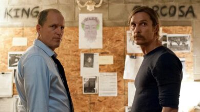 Woody Harrelson and Matthew McConaughey in season 1 of True Detective, standing face to face both looking to the side.