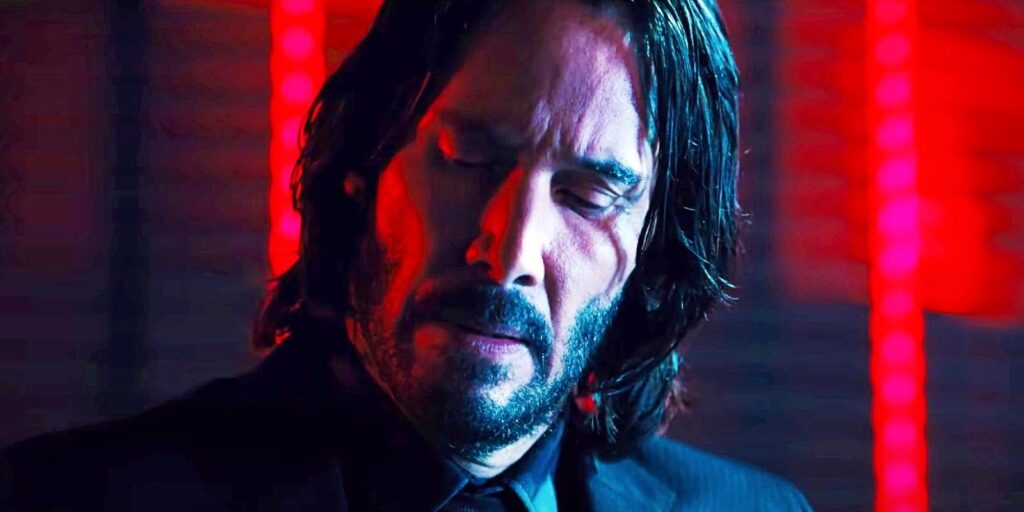 Keanu Reeves looking down in John Wick Chapter 4