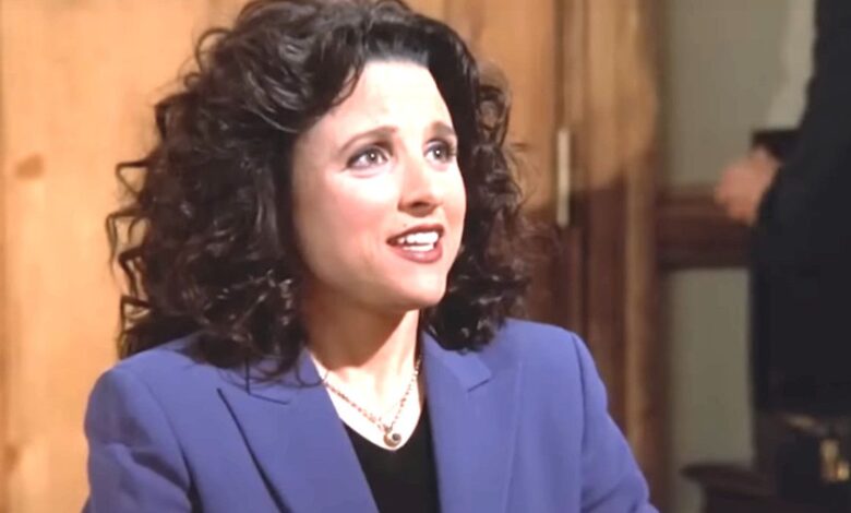 Julia Louis-Dreyfus as Elaine in Seinfeld The Finale sitting in a courtroom office looking concerned