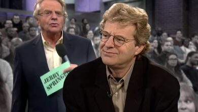 Jerry Springer hosting his Jerry Springer talk show smiling