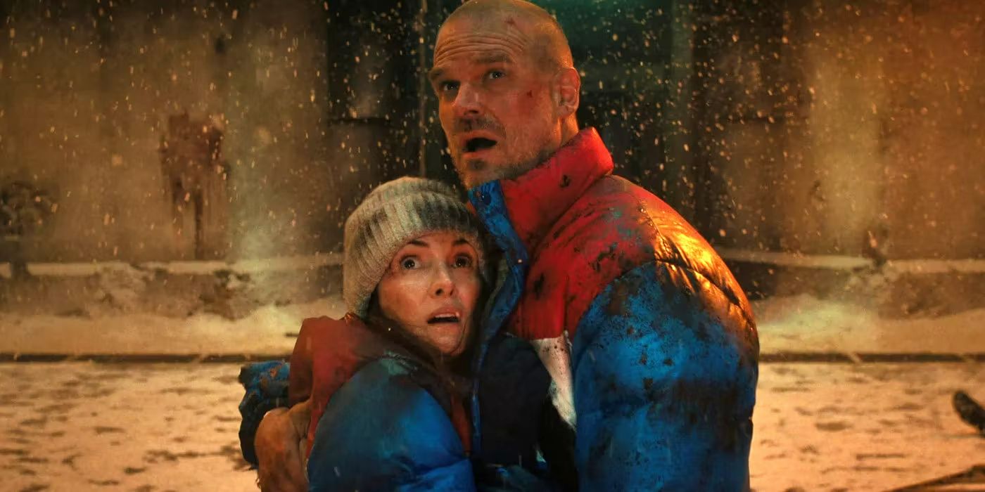 Hopper and Joyce holding each other in Stranger Things season 4