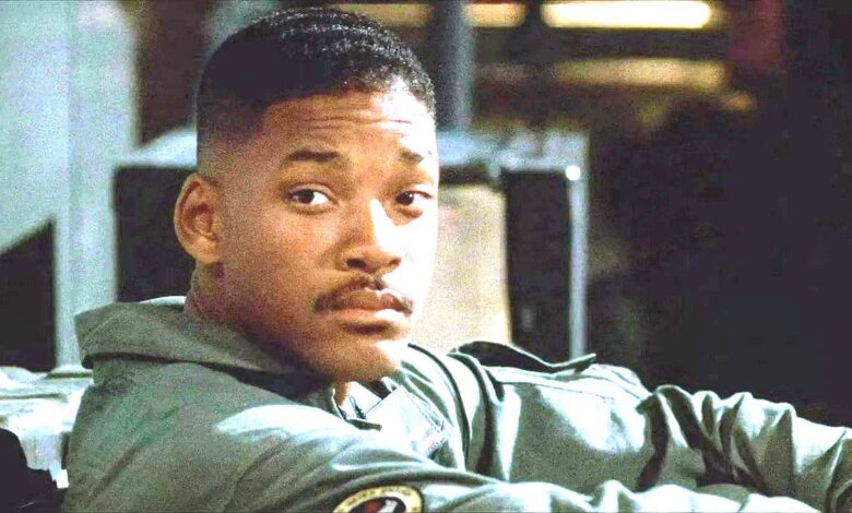 Will Smith In Independence Day in a pilots jumpsuit looking slightly sad