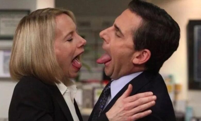 Michael and Holly sticking their tongues out at each other on The Office