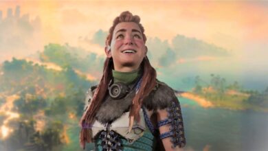 Aloy looking up at the sky and smiling against a landscape from Horizon Forbidden West Burning Shores.
