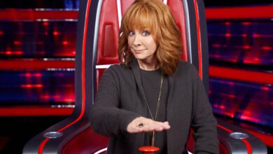 Reba McEntire hitting the red buzzer on The Voice