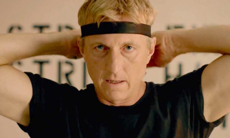 Johnny Lawrence tying his headband in Cobra Kai