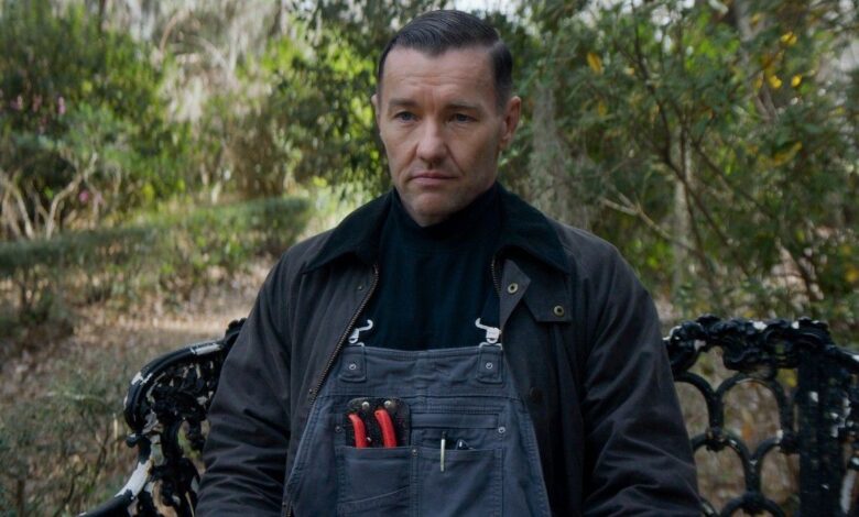 Joel Edgerton's character in Master Gardener sitting on a bench.