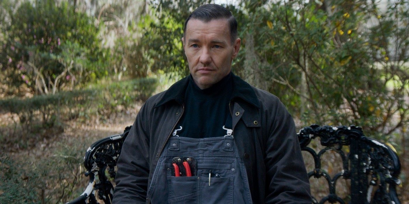 Joel Edgerton's character in Master Gardener sitting on a bench.