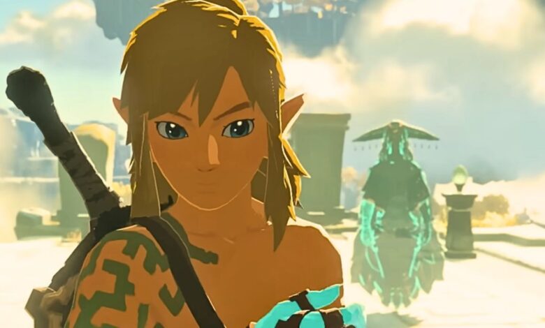 A close-up of Link looking concerned as the ghost of Rauru floats in the background behind him in Tears of the Kindgom.