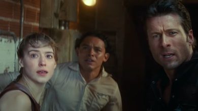 Daisy Edgar-Jones, Anthony Ramos, and Glen Powell looking in shock and awe at a storm in Twisters