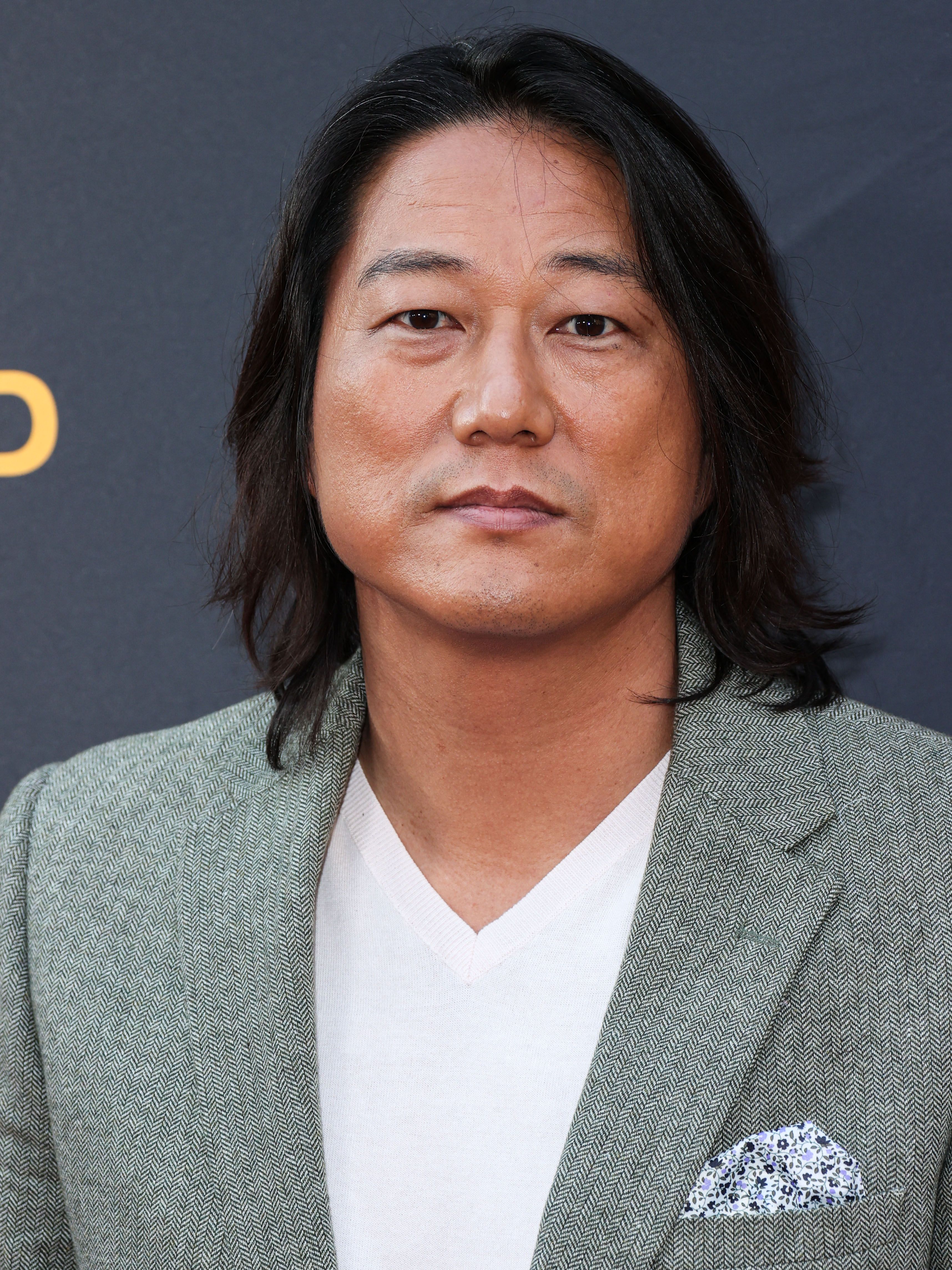 Fiesta de la cabeza de Sung Kang en el Proyecto de Alcance de Charlize Theron Africa (CTAOP) 2023 Block Party 