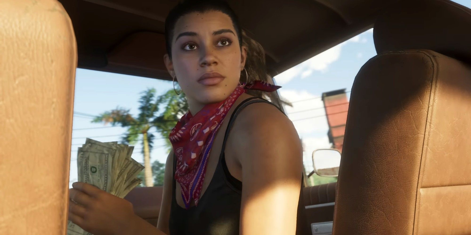 Lucía mirando hacia atrás en el auto con efectivo en la mano en Grand Theft Auto 6.