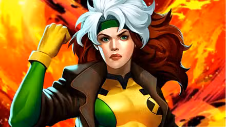 El héroe de X-Men, Rogue, agita su puño frente a la ardiente energía del Fénix Oscuro.