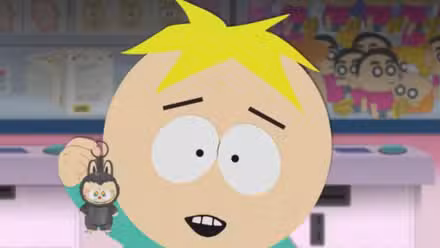 Butters sostiene un Labubu y sonríe en South Park